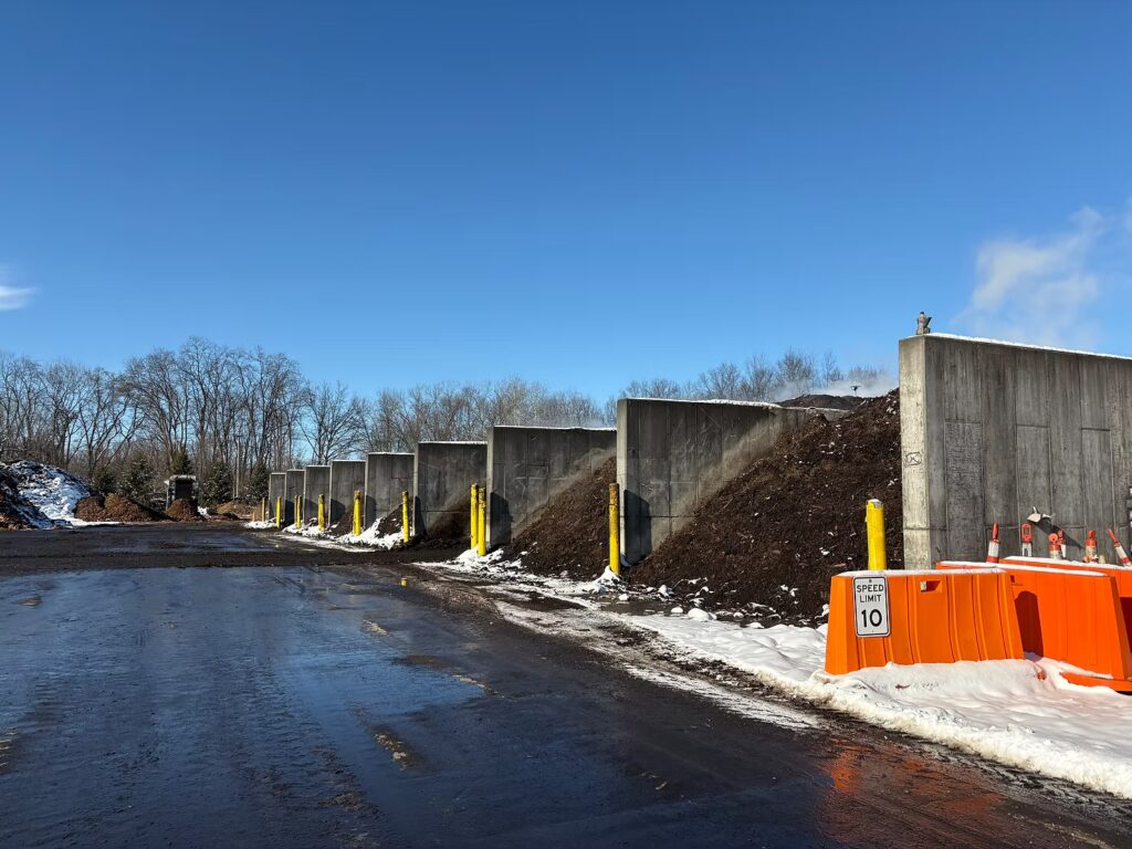 Food waste combined with yard brush are put into bays where they sit for several weeks. Photo by Janice Ha