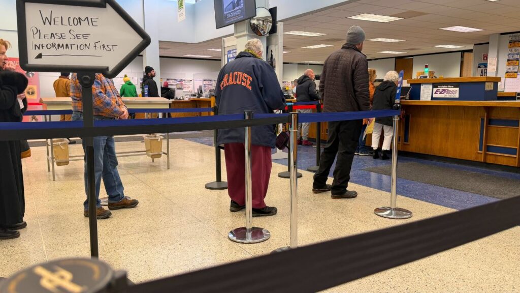 Customers wait in line at a New York State Department of Motor Vehicles office in Madison County, New York, ahead of the statewide office that will temporarily close to install a new, modernized technology system. © Keleigh Arrington