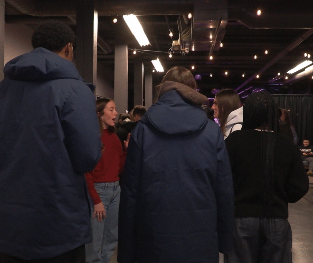 A group of young churchgoers are talking in a small group at The Salt Company worship on Thursday night.