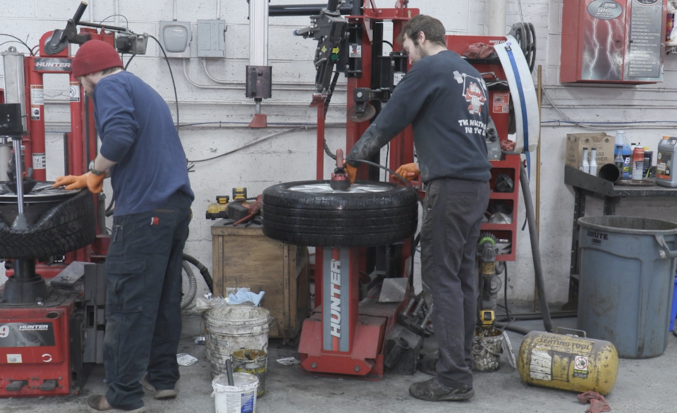 Employees working on tires