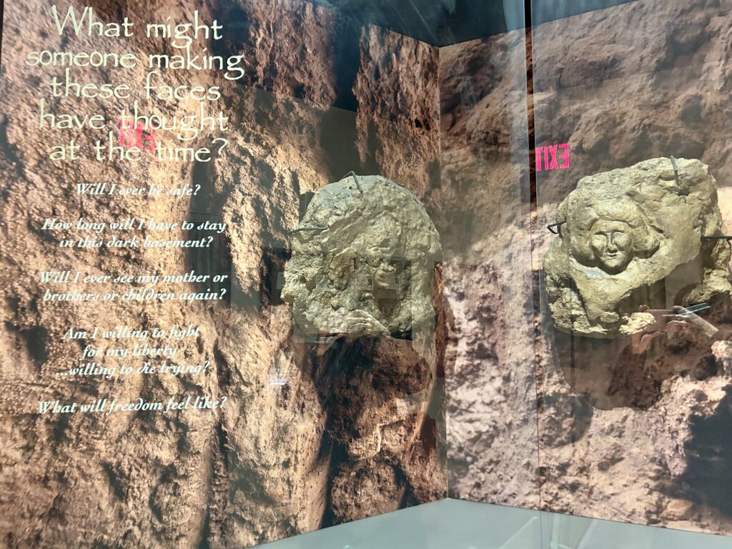 During historic preservation in the late 1990s, several faces carved in clay were discovered in the church basement. They are thought to have been carved by escaping slaves seeking their freedom as they journeyed north. Several of the faces were removed and are now on exhibit at the Onondaga Historical Association museum. ©Marisa Nuñez