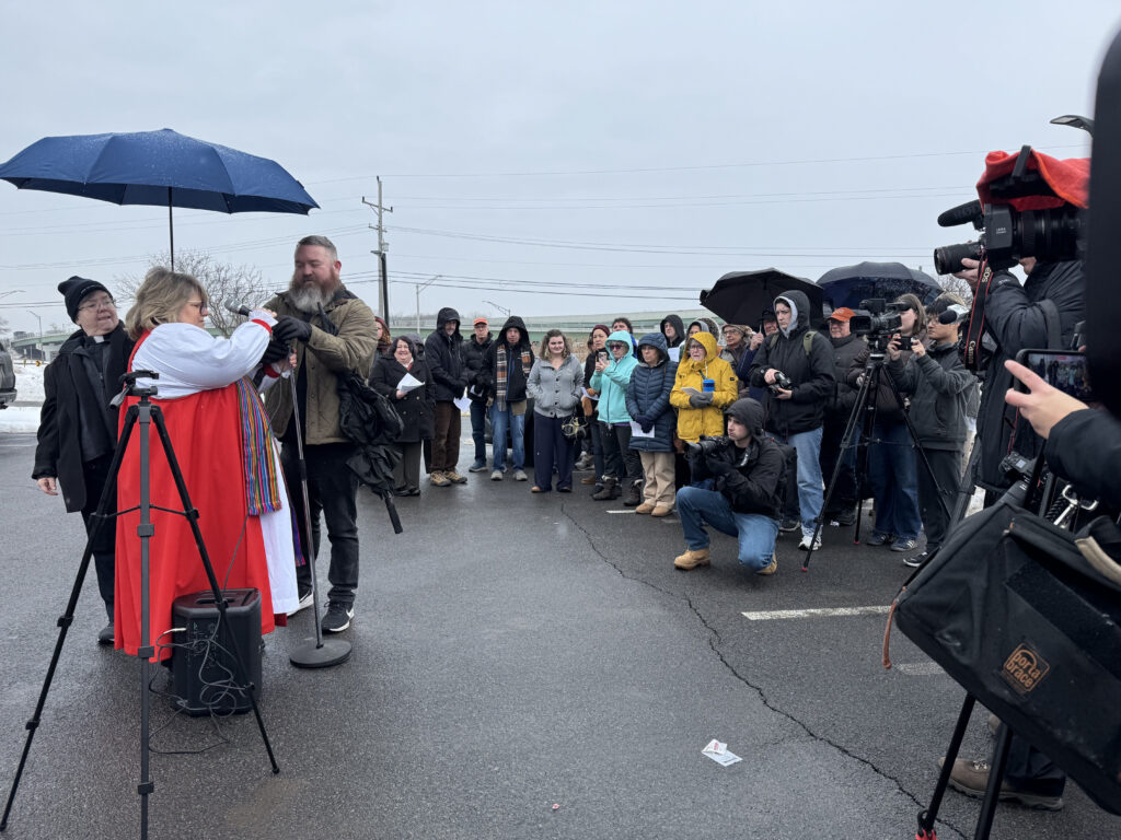 People gathered outside of the CNY ICE Offices for an Ash Wednesday Prayer Service