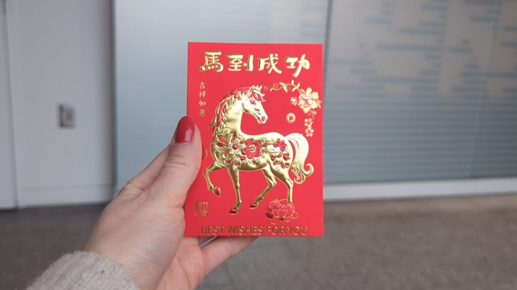 Red pockets are traditional red envelopes containing money, gifted during Lunar New Year. This year, there is a picture of a horse on it. 