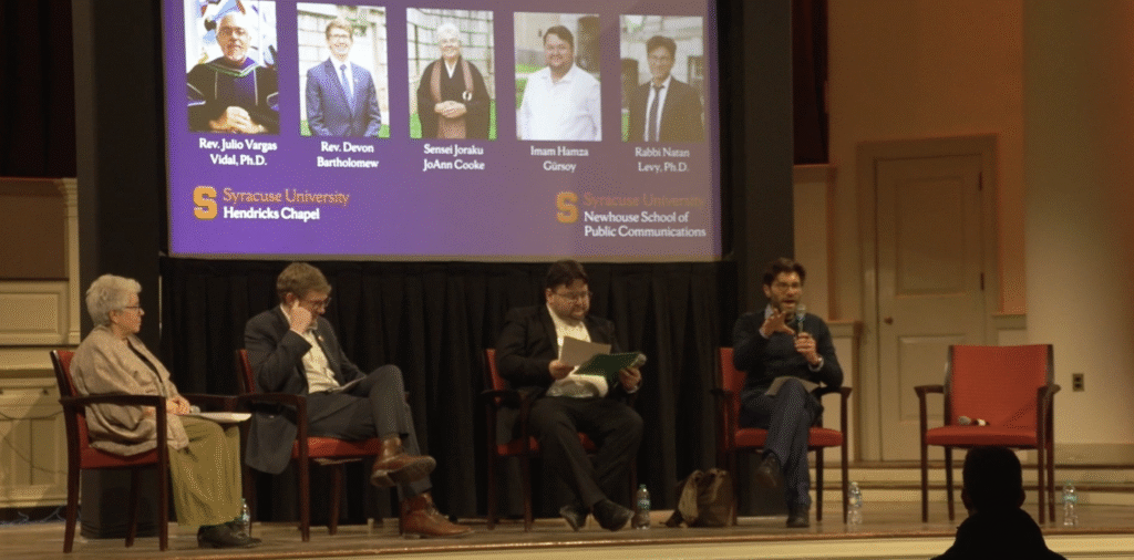 Faith leaders sit on a panel at Hendricks Chapel at Syracuse University during an interfaith discussion on immigration concerns.