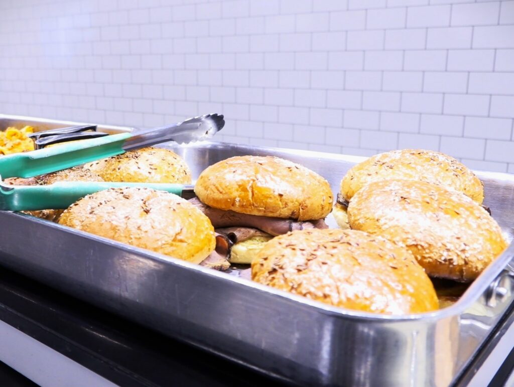 Beef on Kummelweck Roll: Roast beef served on a salted, caraway-seed roll.