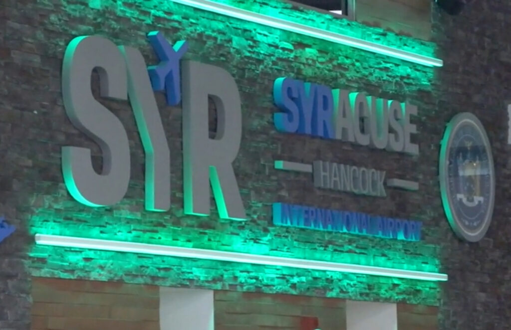 Syracuse Hancock Airport Sign with green 