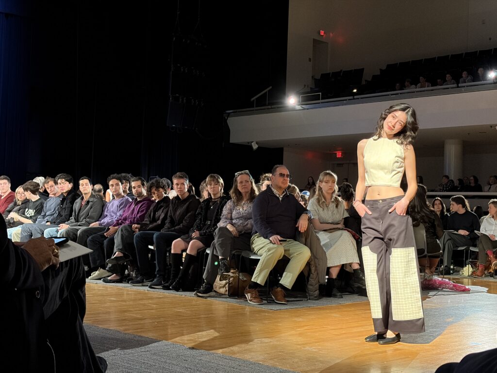 A model poses for the camera during the 2026 Senior fashion show.