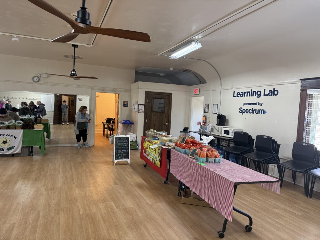 Table set up with produce and salsas