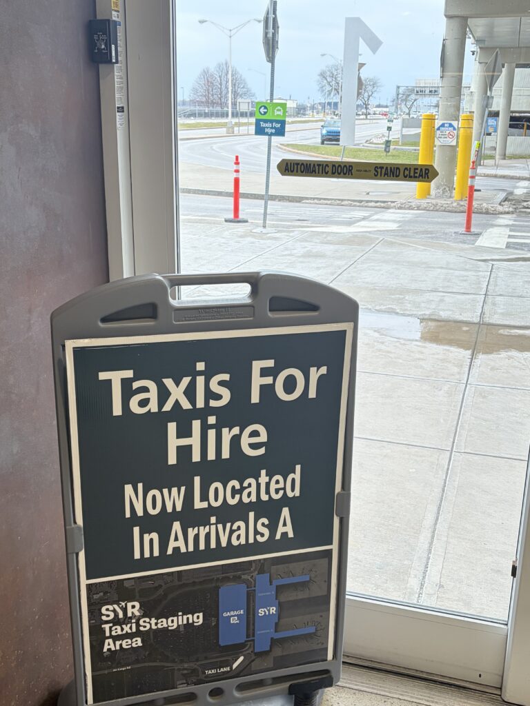 Signage at Syracuse Hancock International indicating where to find taxi's while renovations are starting.