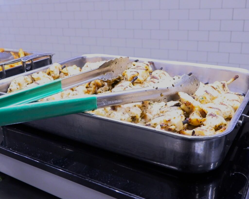 Chicken Spiedies: Marinated, skewered meat sandwiches.