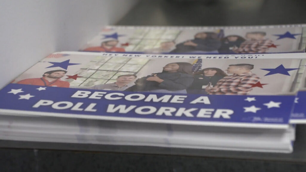 White text saying "become a poll worker" with a woman smiling and giving a thumbs up in front of four other people.