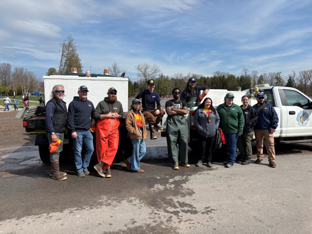 carpenter's brook fish hatchery members satnding in a line in front of a truck