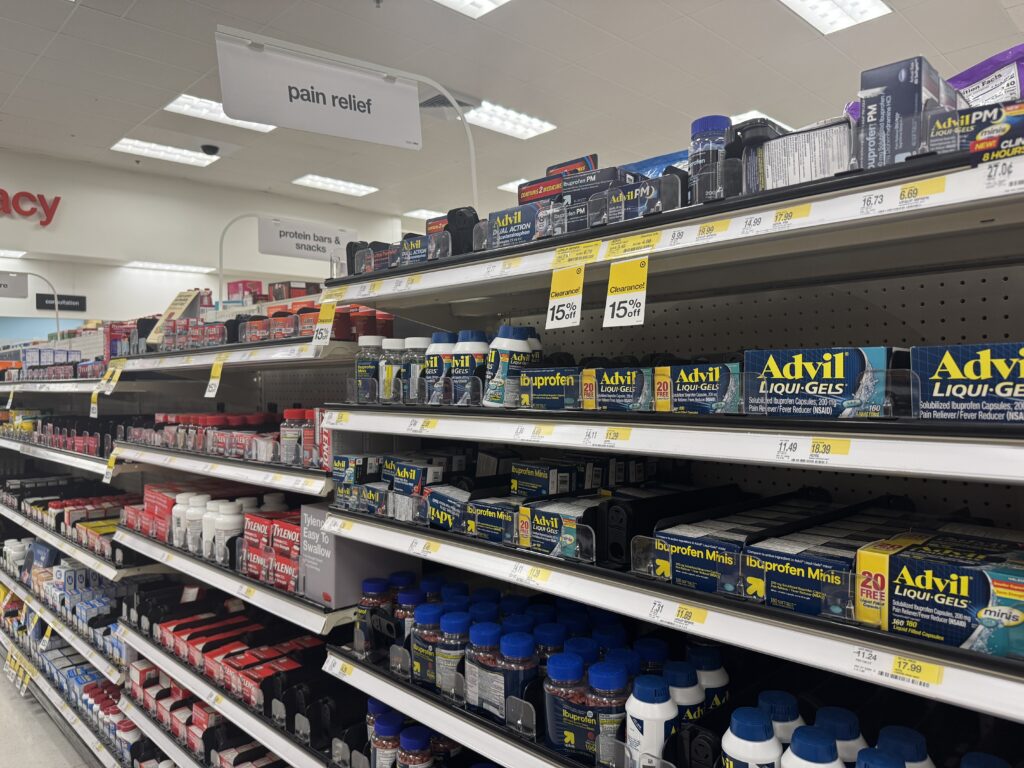 Medicine for pain relief is layed out on shelving in a Target pharmacy.