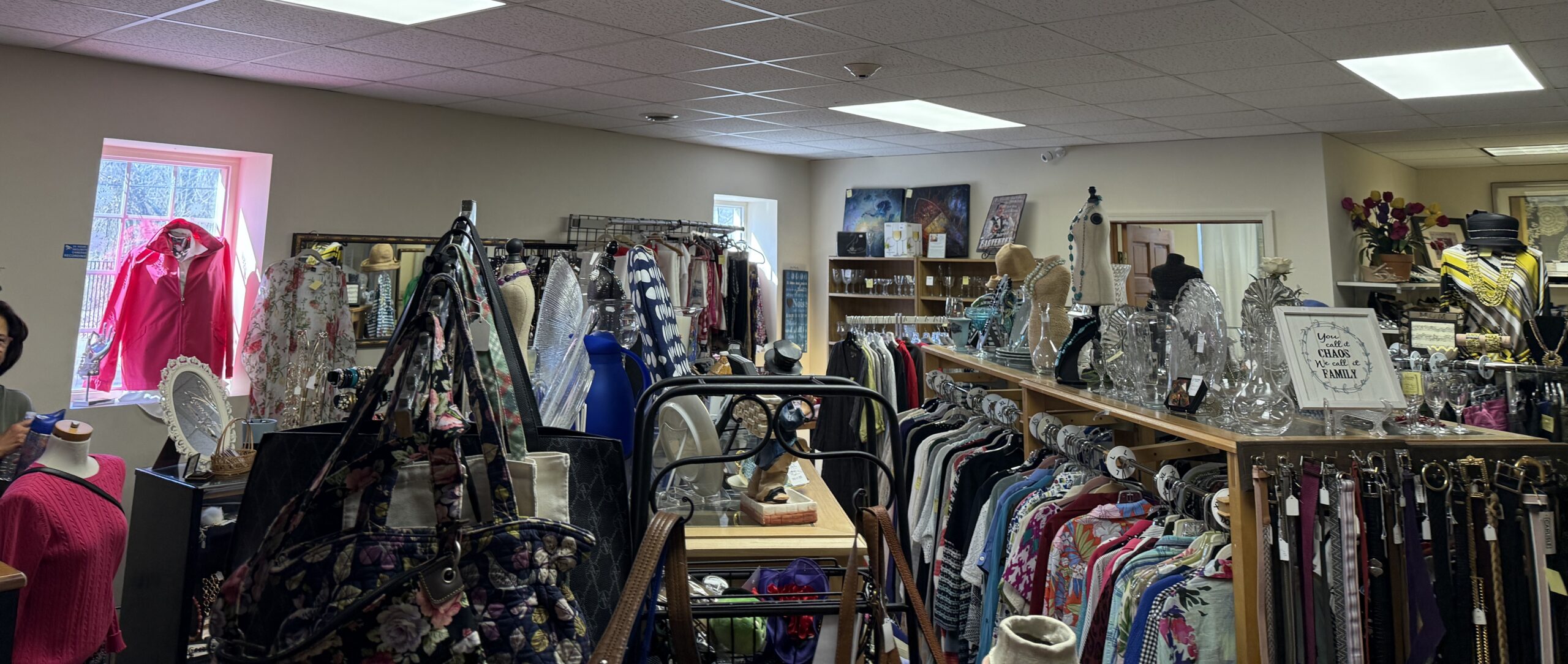 Clothing racks and shelves inside Encore Thrift Store
