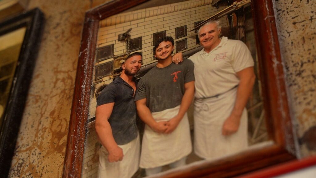 Picture frame with family photo of three men