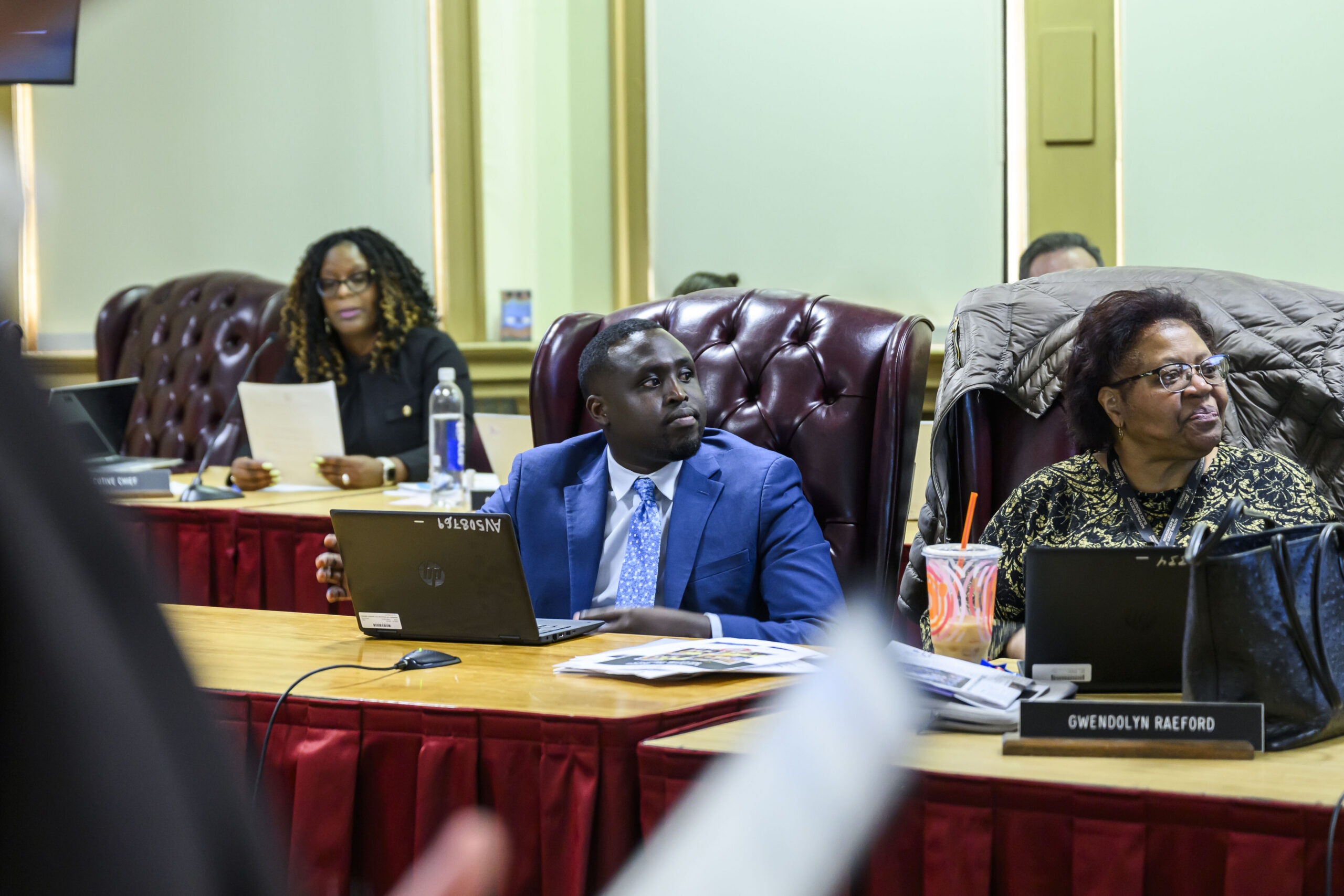 Desire Ndagijimana sits at his first school board meeting. 