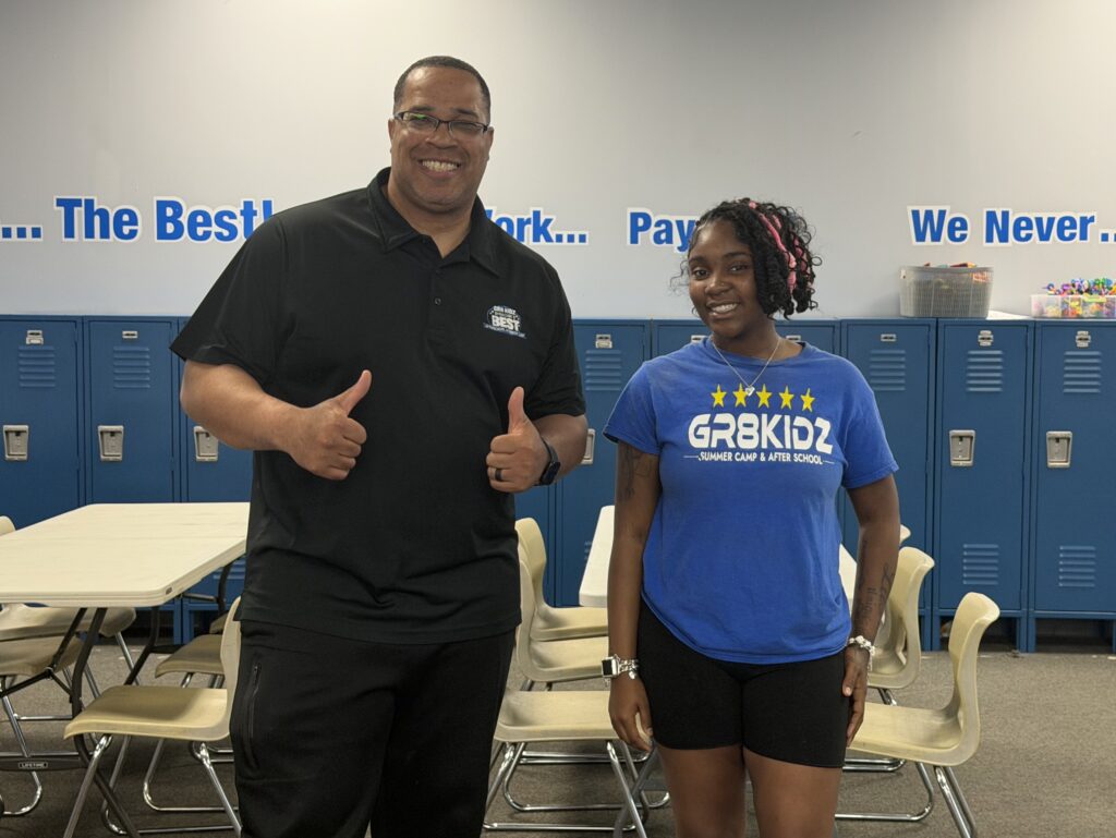 Man gives thumbs up next to woman