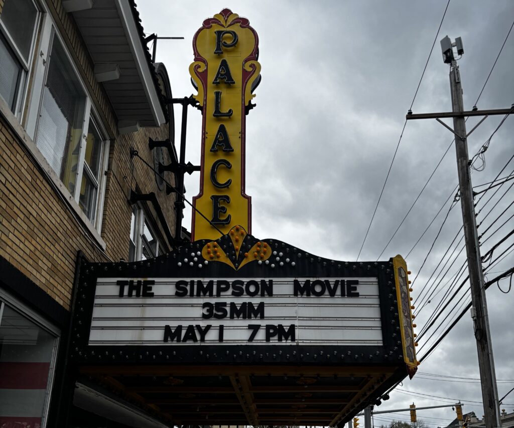 Palace Theatre marquee displays “The Simpson Movie 35MM May 1 7PM” 