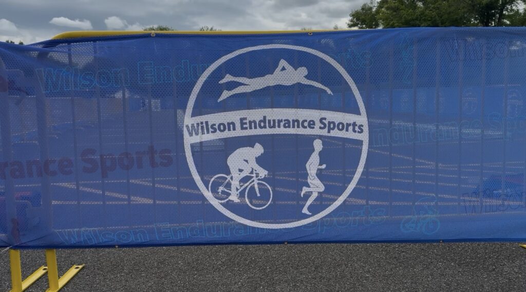 Wilson Endurance Sports logo outlined on the edge of the bike racks.