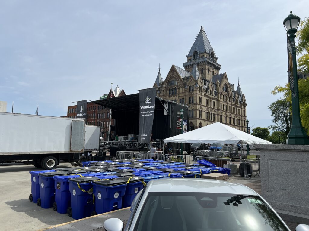 Taste of Syracuse staff members set up the Main Stage for the Taste of Syracuse in Clinton Square.