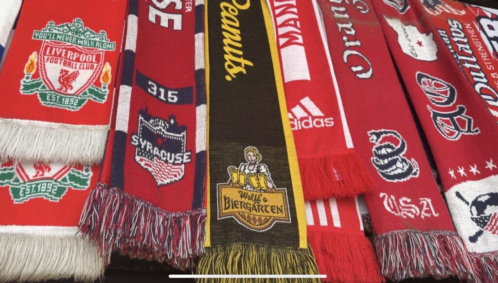 close up of soccer scarves hanging up