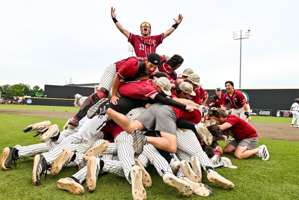 Troy University Trojans dog piling at the Troy Super Regional after securing a spot in Omaha.