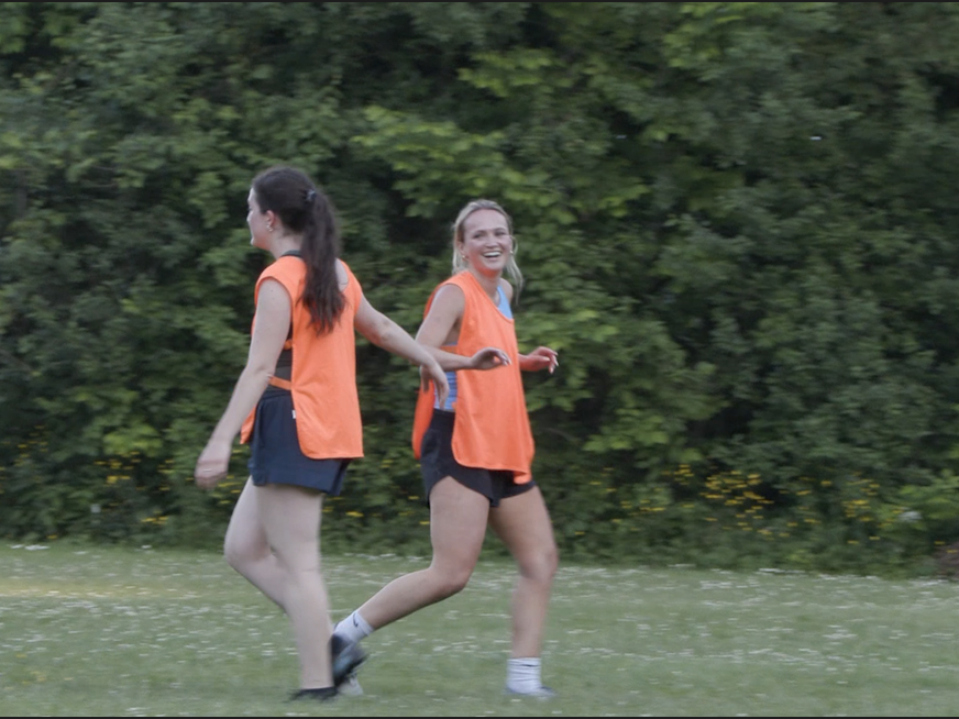 Lexi Bird (left) and Kristen Boyd (right) celebrate after scoring in a practice scrimmage