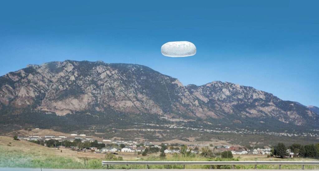 Artist's rendering of a white, potato-shaped object hovering over a mountain range.
