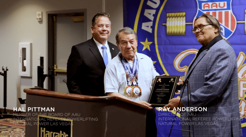 Ray receiving a powerlifting award at an age many would think to be impossible