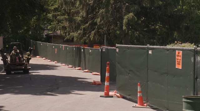 Long stretches of construction fencing and traffic cones block access to portions of the Mills Rose Garden