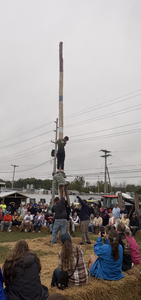 Competitors from "Matthew A" attempt to climb pole