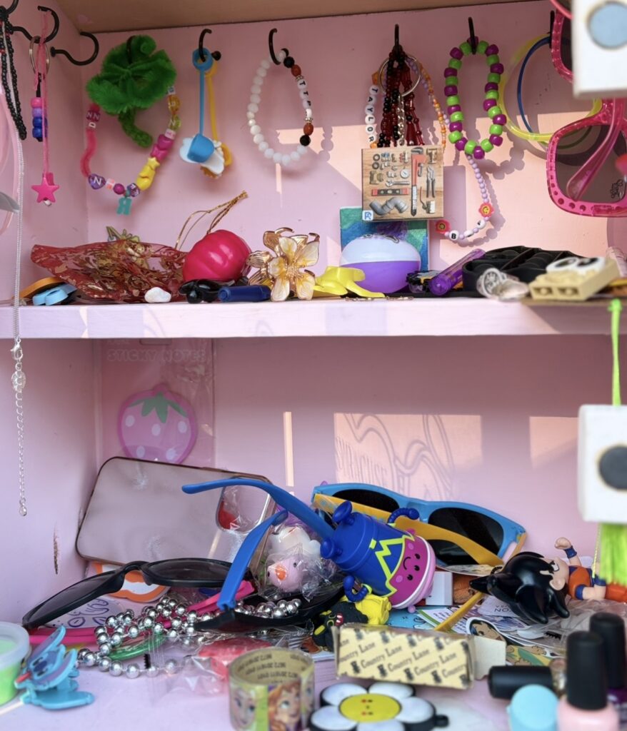 Various friendship bracelets, toys and trinkets