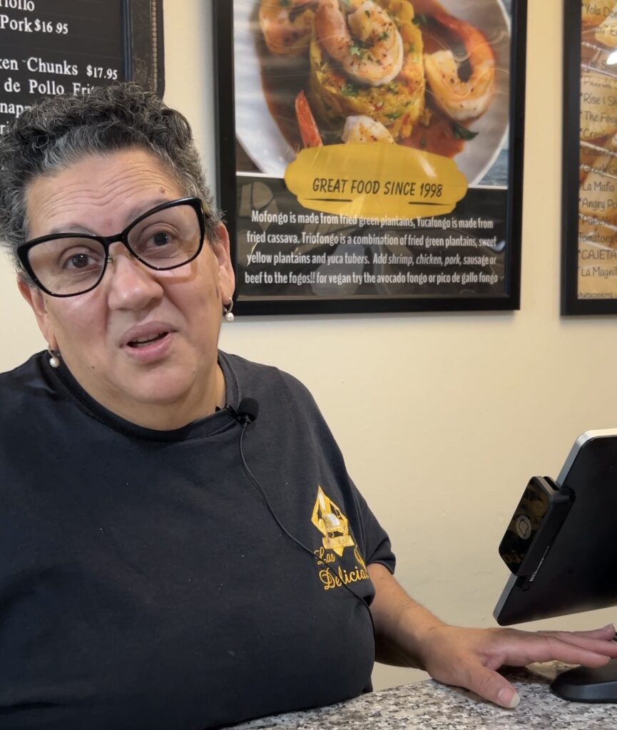 Carlie Morales, Las Delicias employee, said her empanada restaurant lost a group of customers since the theater's been closed. © Teaghan Brostrom.