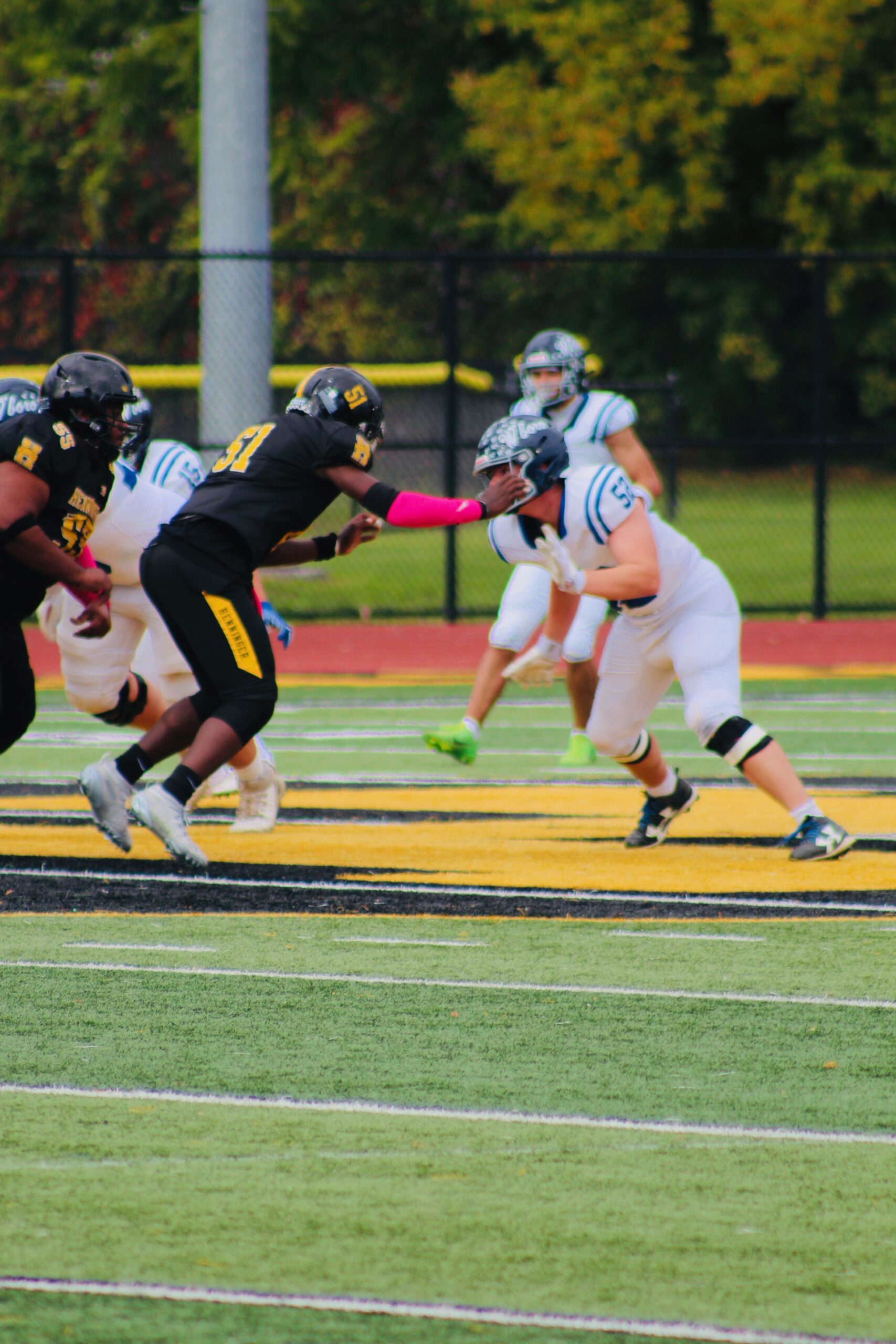 TJ Innis (51) blocks in a game for Henninger High School. Innis plays offensive line, running back and linebacker for the Black Knights.