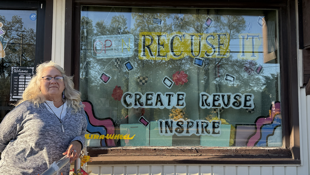 Kim Davis stands in front of her store ReC'use It.